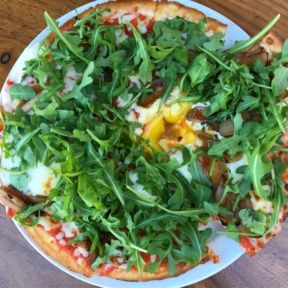 Gluten-free pizza with an egg from Rosti Tuscan Kitchen